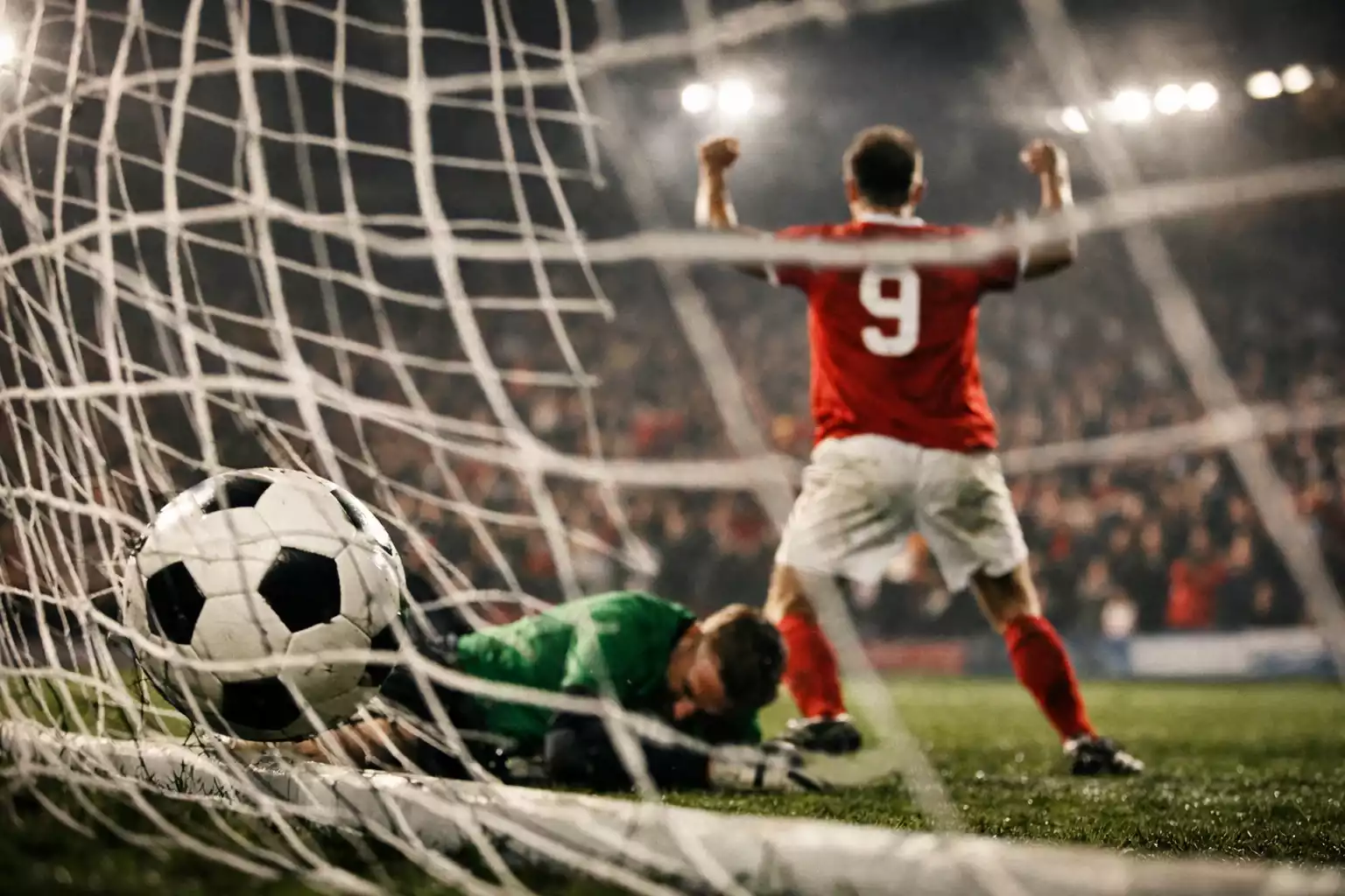 Celebraci&oacute;n de gol con portero en el suelo y red movida